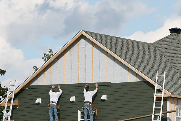 Professional Storm Damage Siding Repair technician working in Cedarhurst, NY